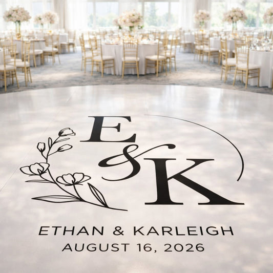 a large white floor with a black and white logo that reads "Ethan & Karleigh" and "August 16, 2026". The logo is surrounded by a floral design.